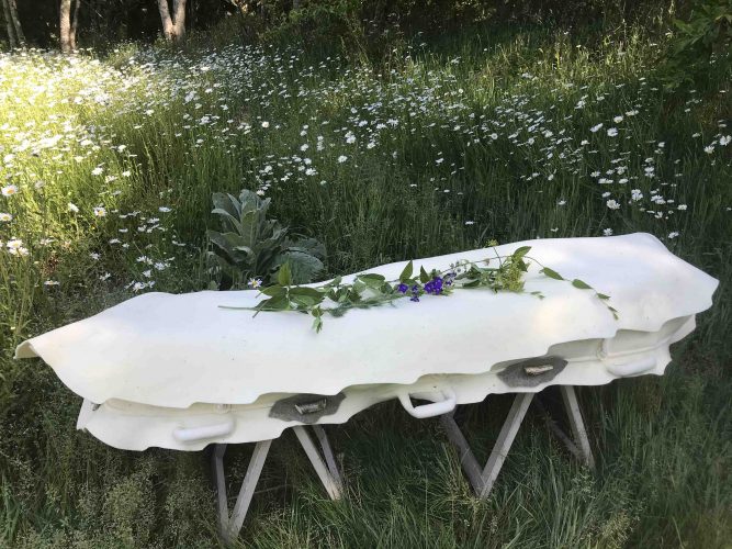 Cream colour felt shroud by Bellacouche in a field of daisys